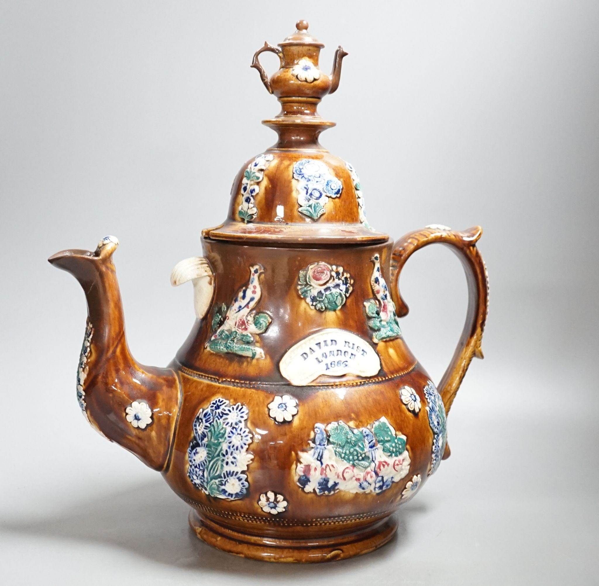 A large Measham bargeware teapot, 1886 (restored) 40cm